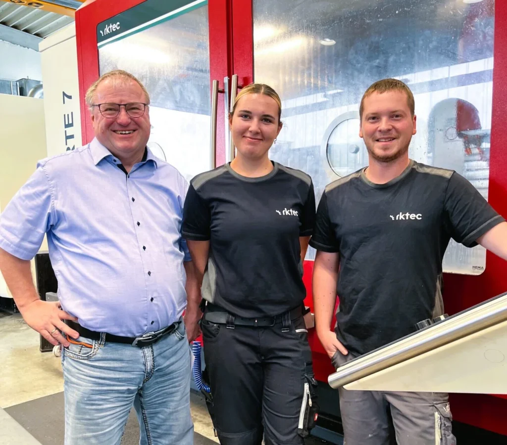 Company owner Richard Klostermeier, apprentice Emily Fichtl, and trainer Martin Prechtl